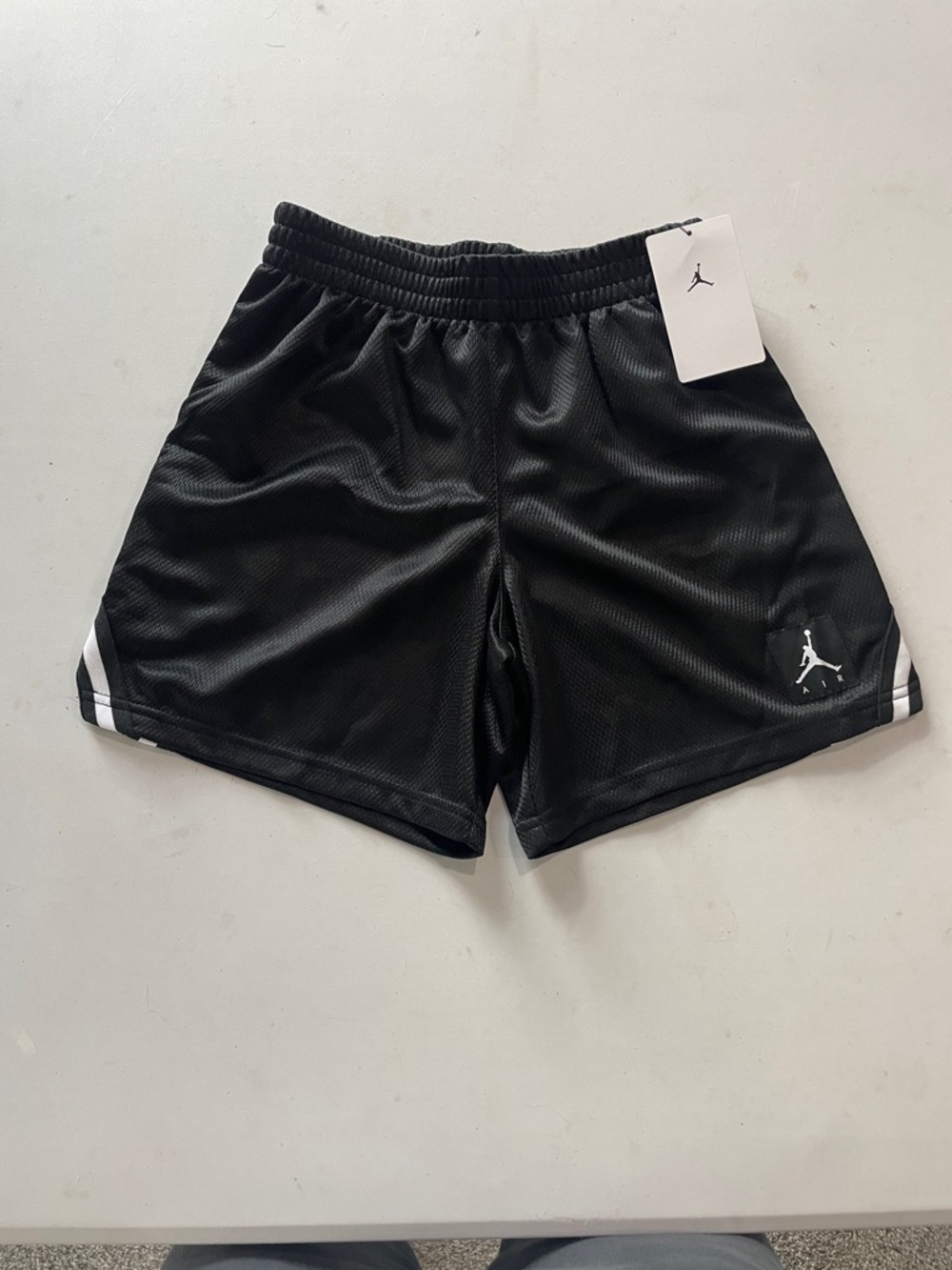 NEW! BLACK JORDAN BASKETBALL SHORTS W/ WHITE TRIM. SIZE SMALL (8-10) BOYS.
